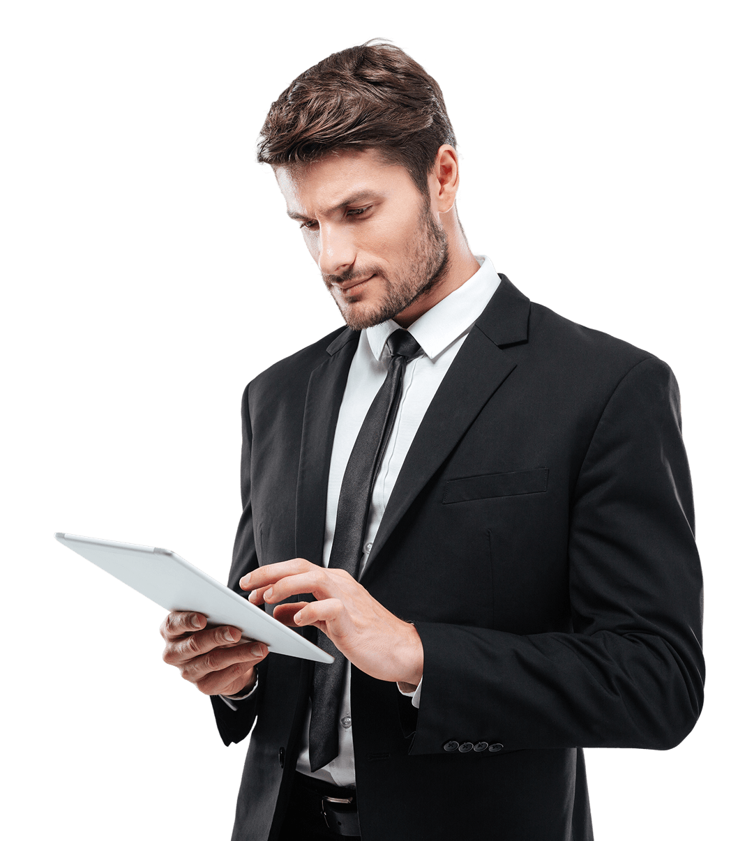 Man in suit using tablet device.