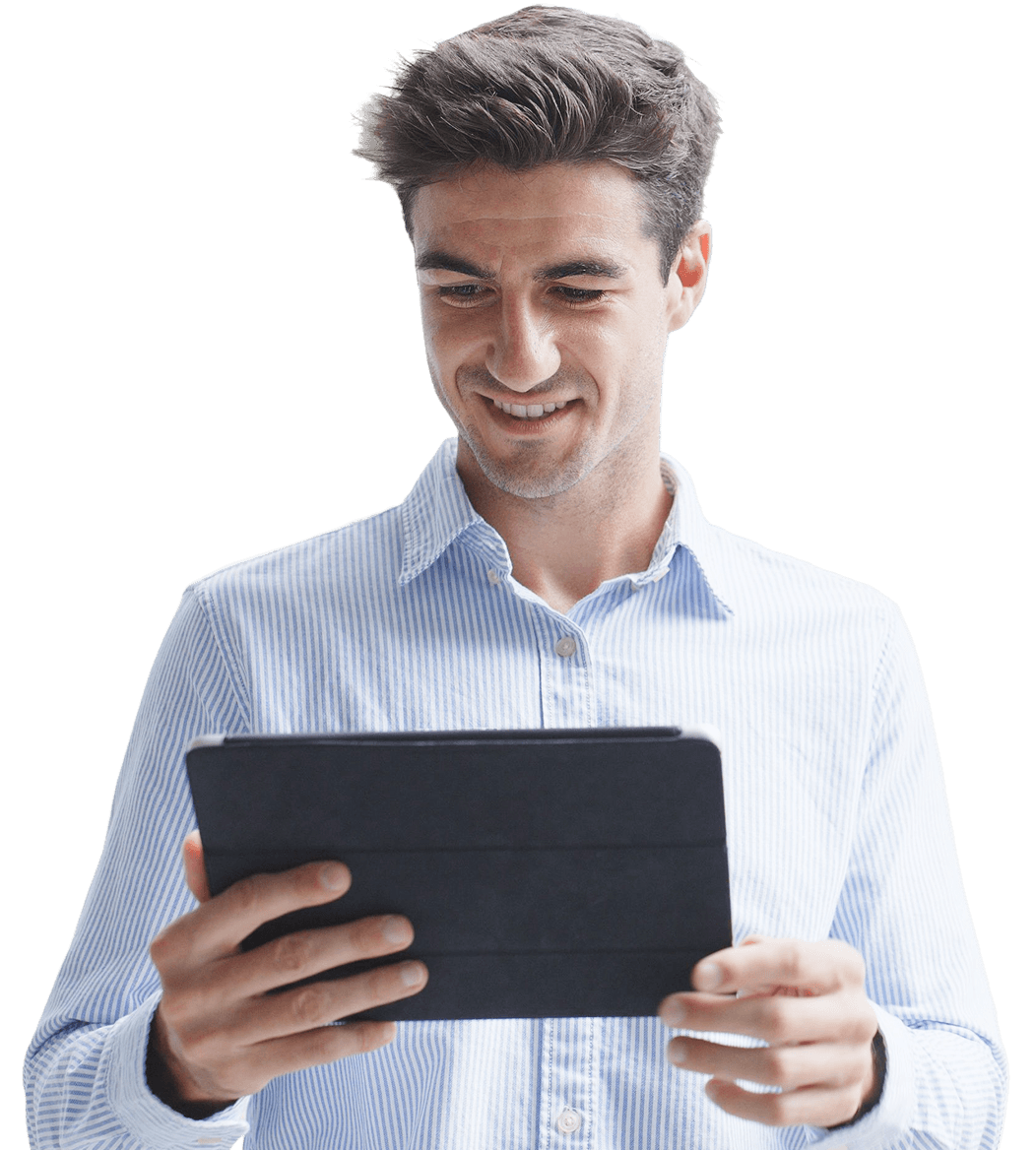 Man smiling while holding tablet.