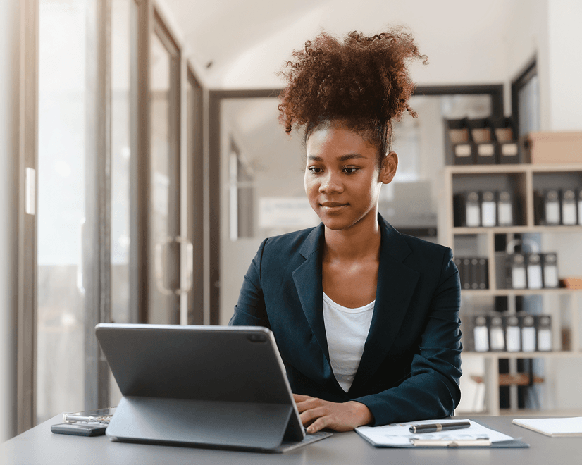 Woman working on tablet in office